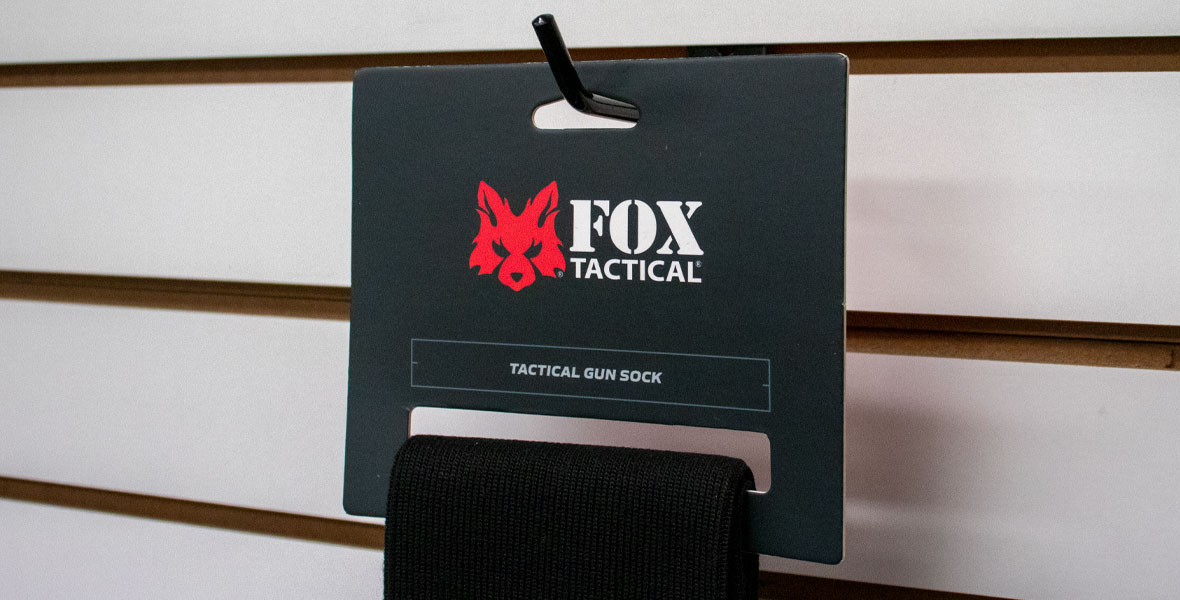 Gun sock header card hanging on a hook with product looping through.